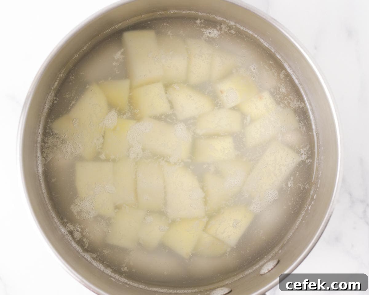 Boiling the potato.