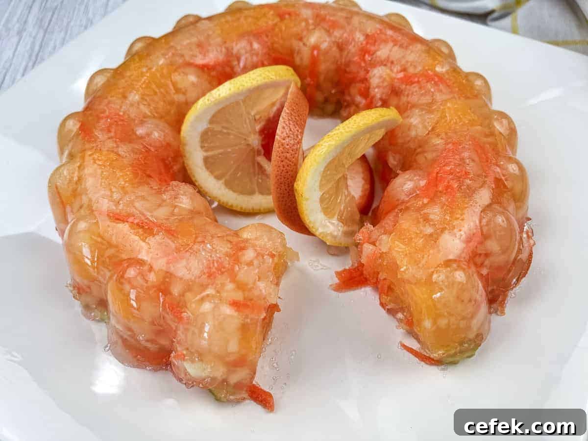 Sunshine salad with slices of oranges in the center served on a white plate.