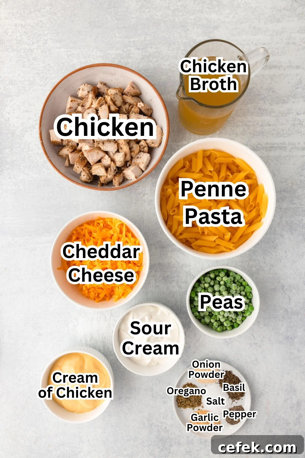 Chicken Pasta Bake ingredients in bowls and containers on a light surface, ready for cooking.