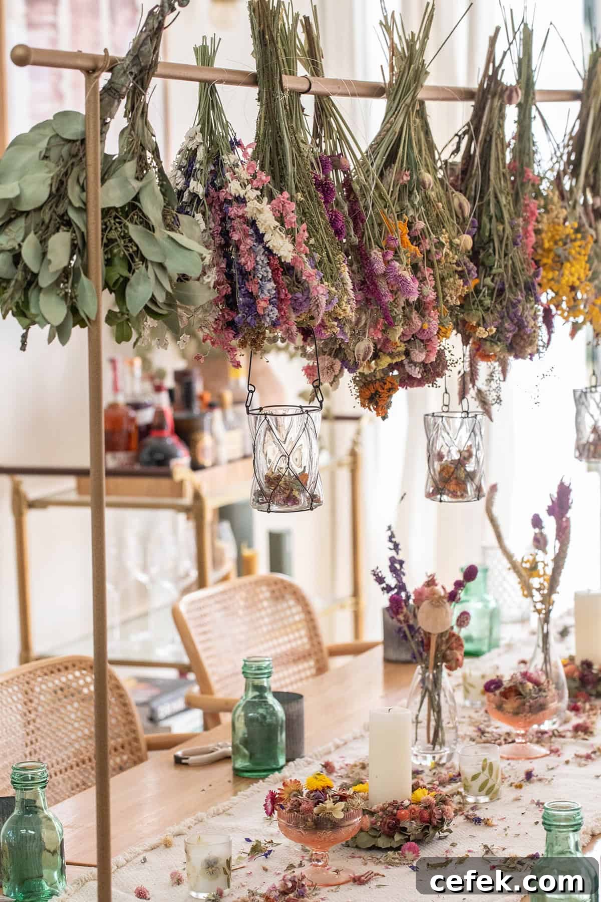 Dried flowers hung from a gold bar.