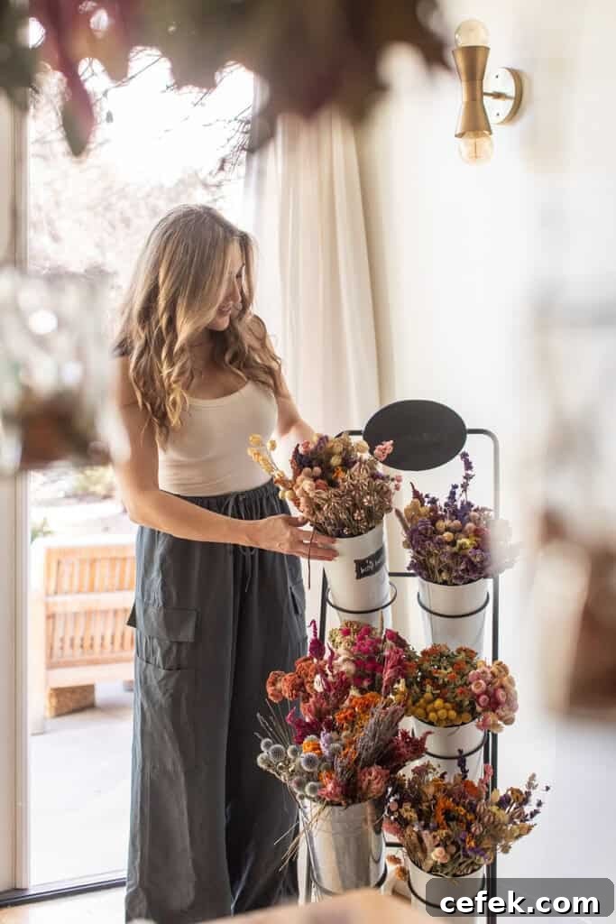 Eden Passante arranging dried flowers.