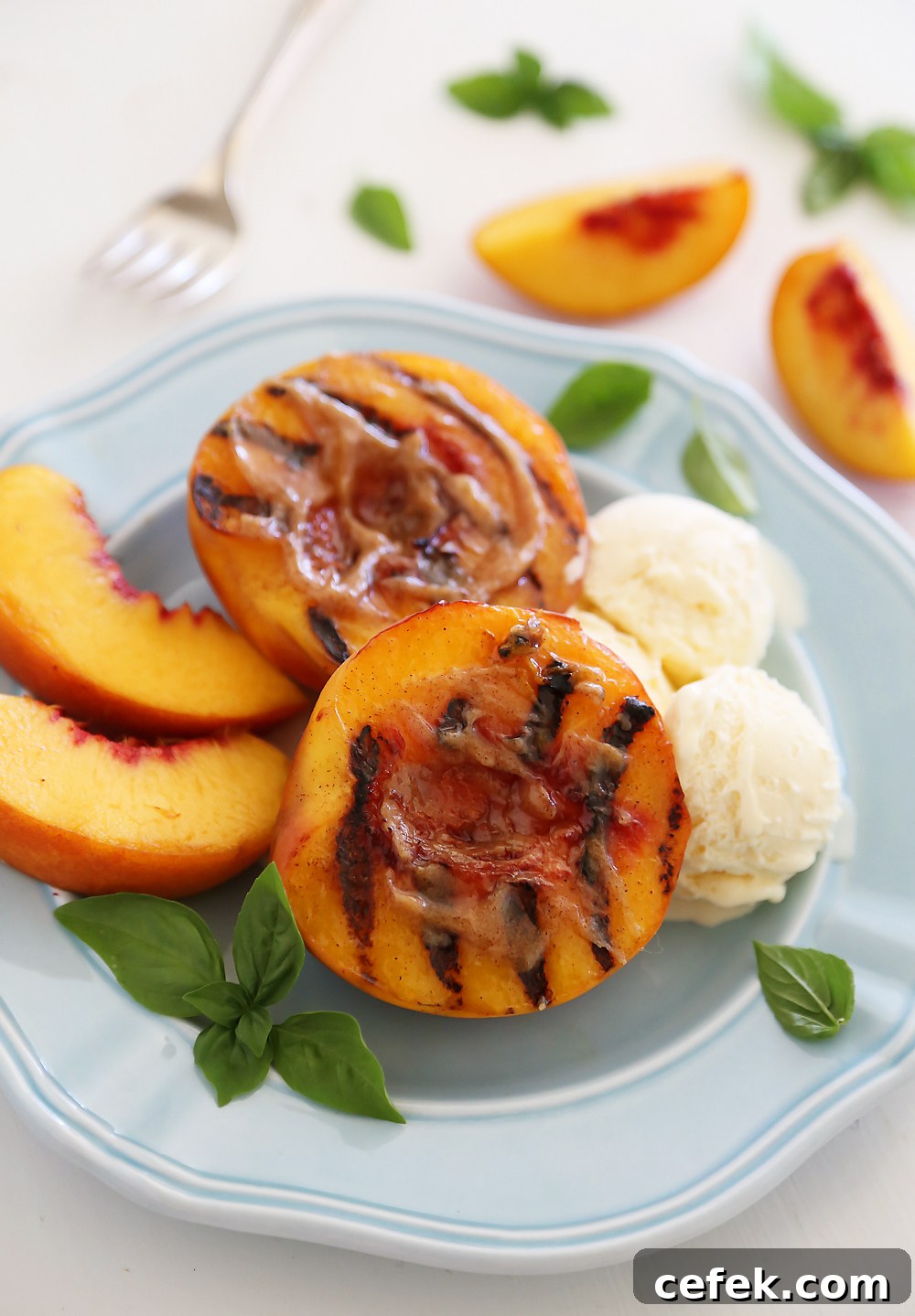 Grilled Peaches with Cinnamon-Sugar Butter – Juicy, sweet grilled summer peaches make a mouthwatering dessert with vanilla ice cream or whipped cream!