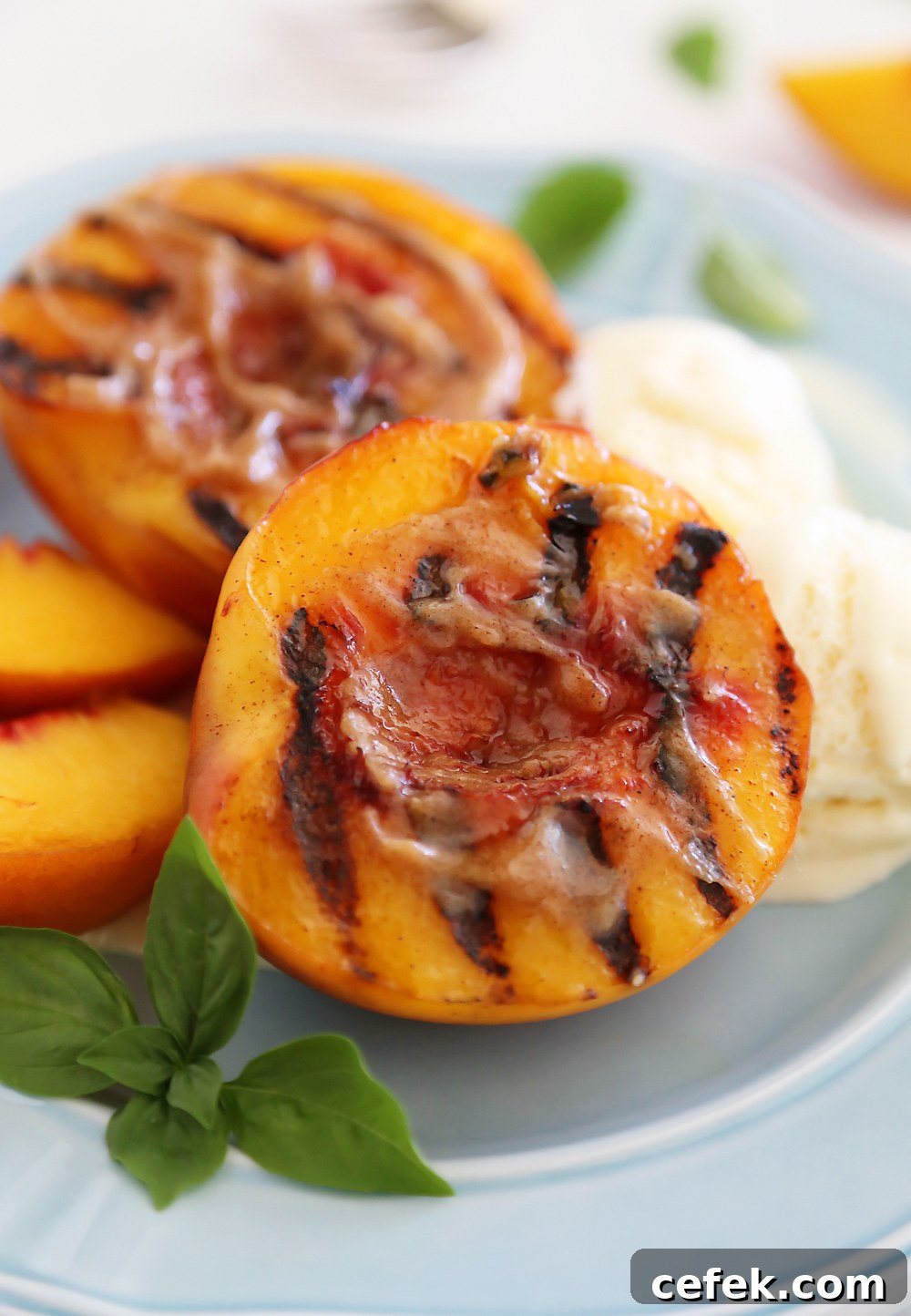 Grilled Peaches with Cinnamon-Sugar Butter – Juicy, sweet grilled summer peaches make a mouthwatering dessert with vanilla ice cream or whipped cream!