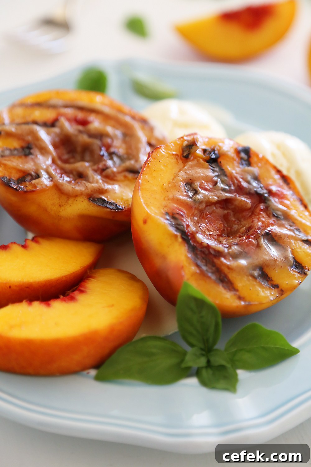 Grilled Peaches with Cinnamon-Sugar Butter – Juicy, sweet grilled summer peaches make a mouthwatering dessert with vanilla ice cream or whipped cream!