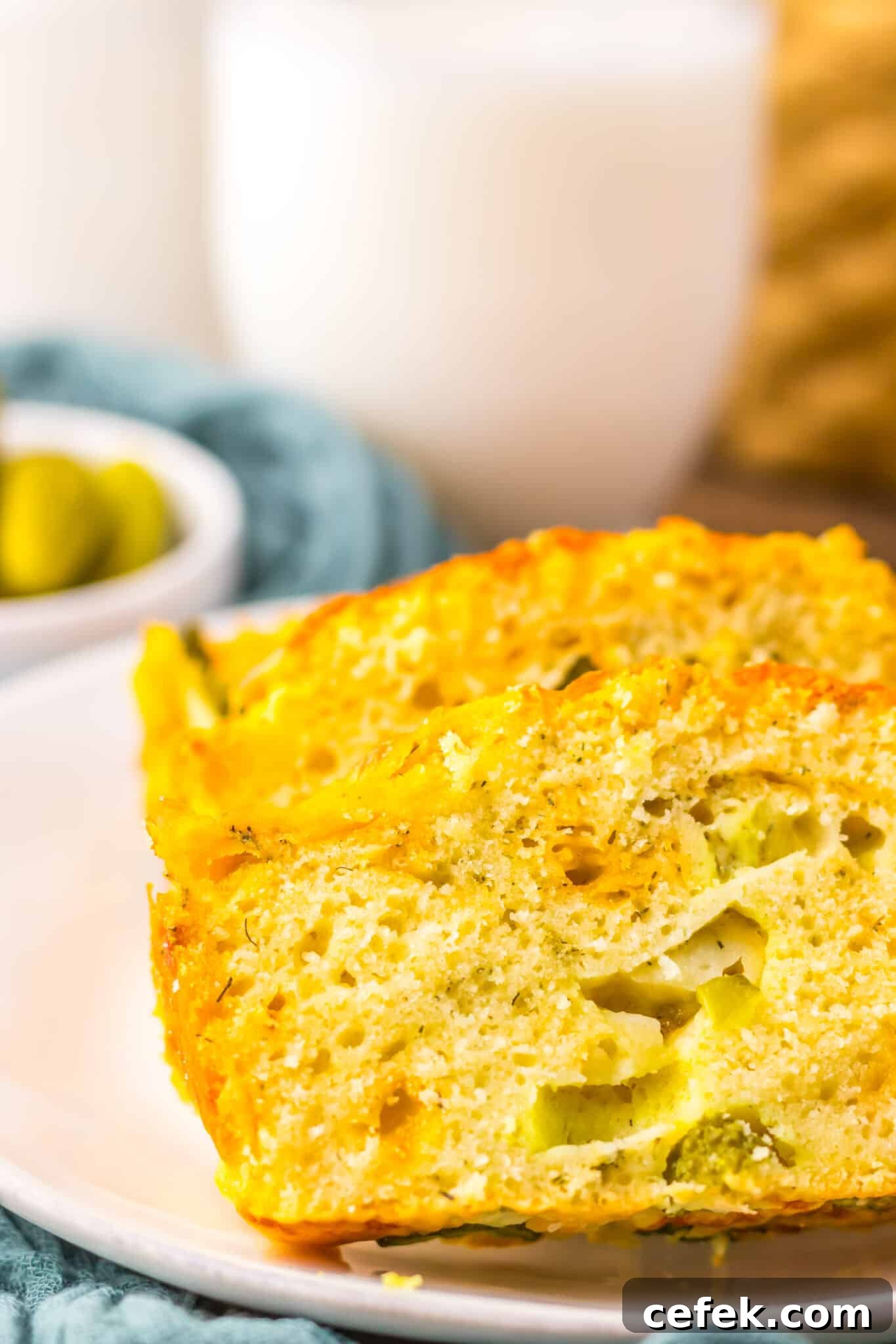 up close side view of slice of dill pickle bread on plate