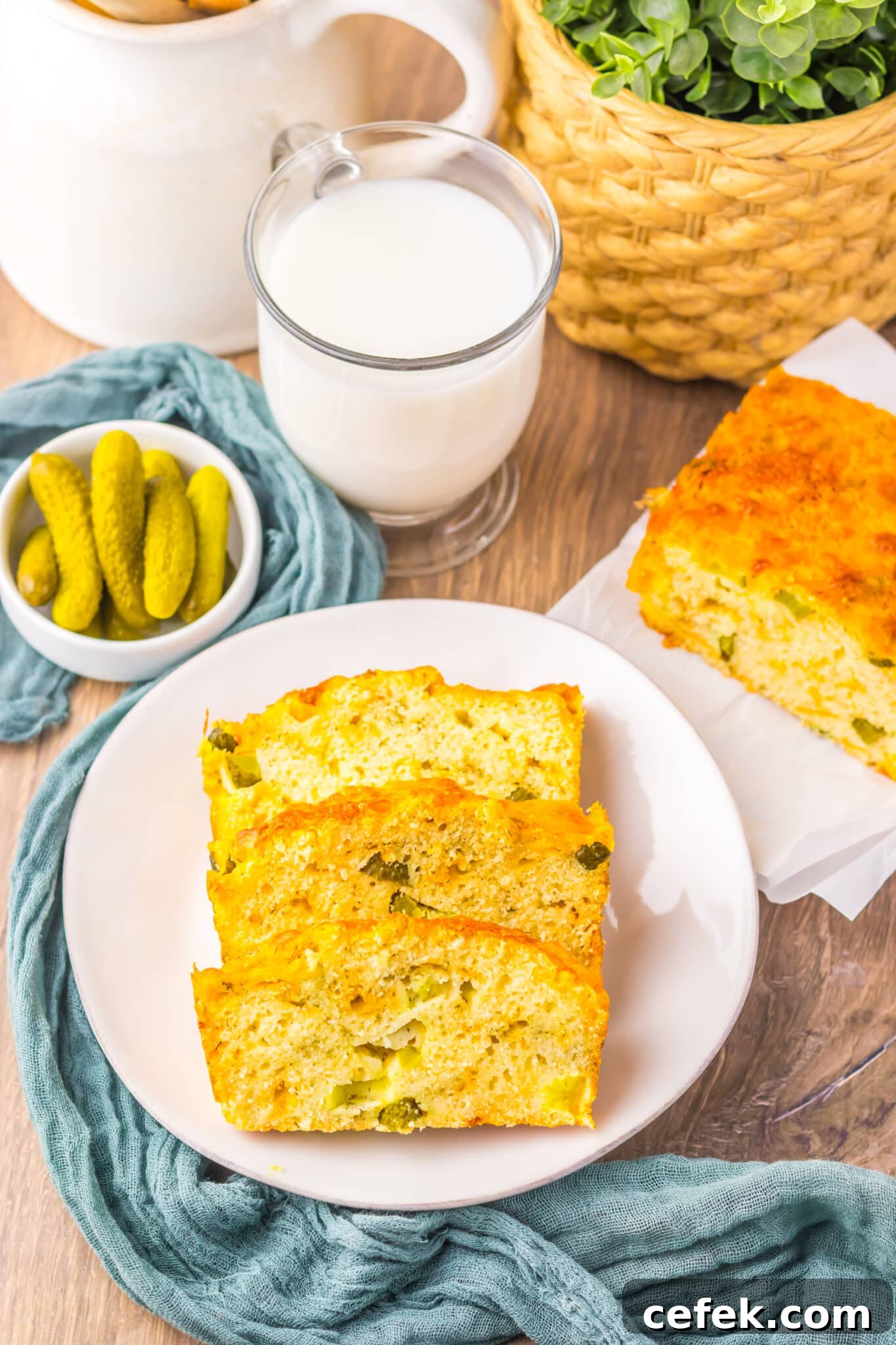 overhead view of 3 slices of dill pickle bread on white plate