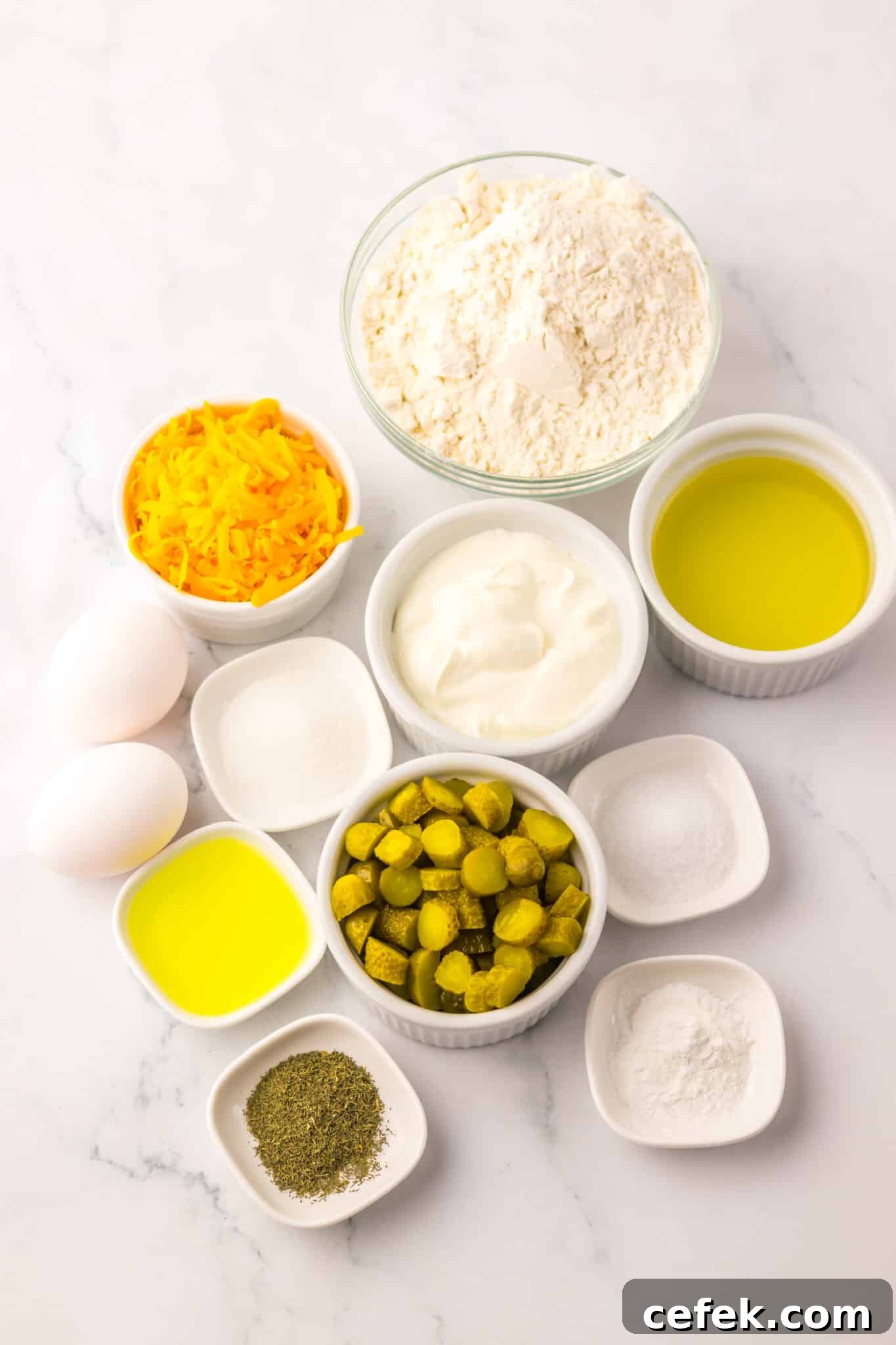 raw ingredients needed to make dill pickle bread on white table
