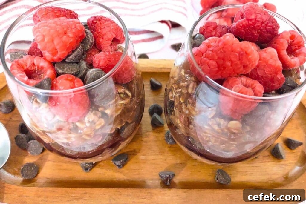 Raspberry Chocolate Overnight Oats Recipe for Morning Boost 8 glasses of overnight oats filled with fresh raspberries and chocolate drops
