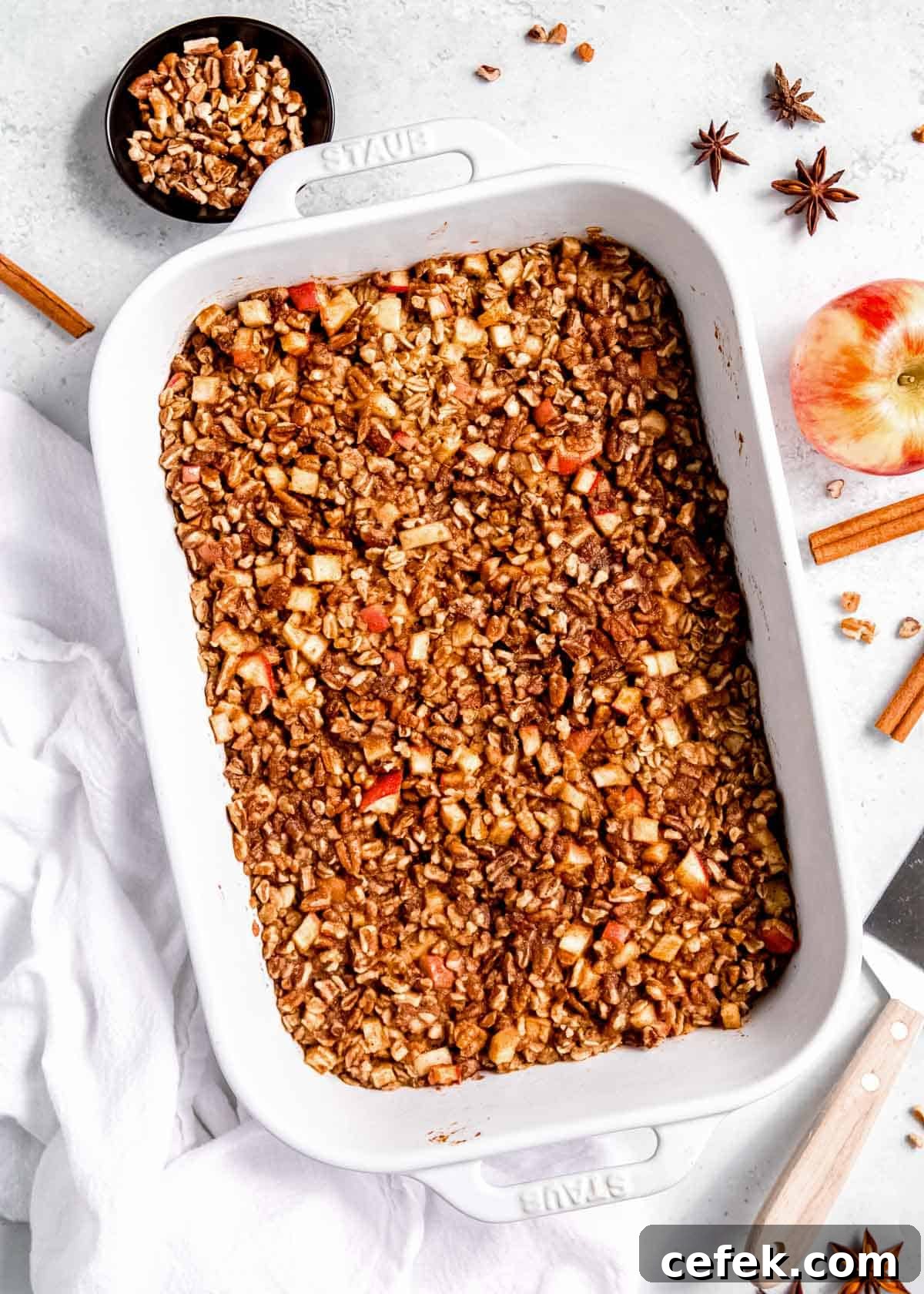 a large baking dish full of baked apple cinnamon oatmeal