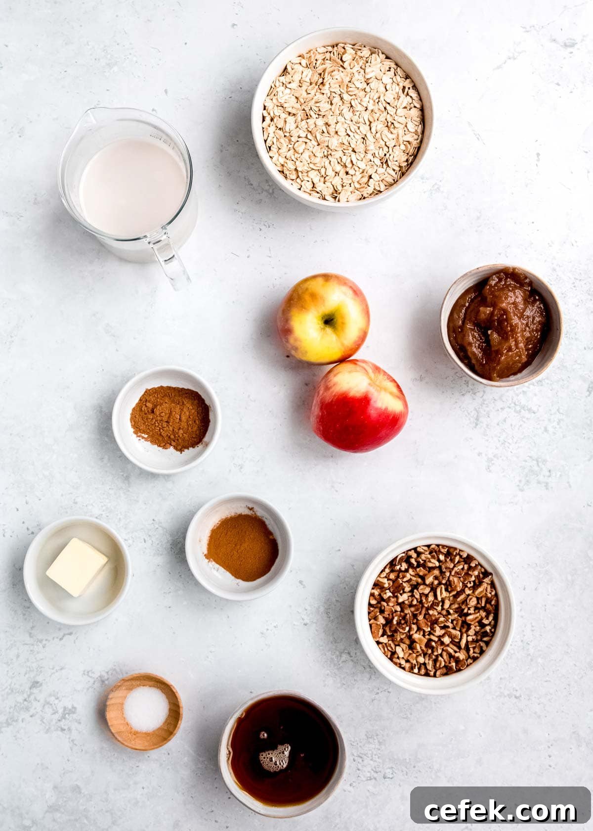 individual ingredients in bowls for apple cinnamon baked oatmeal