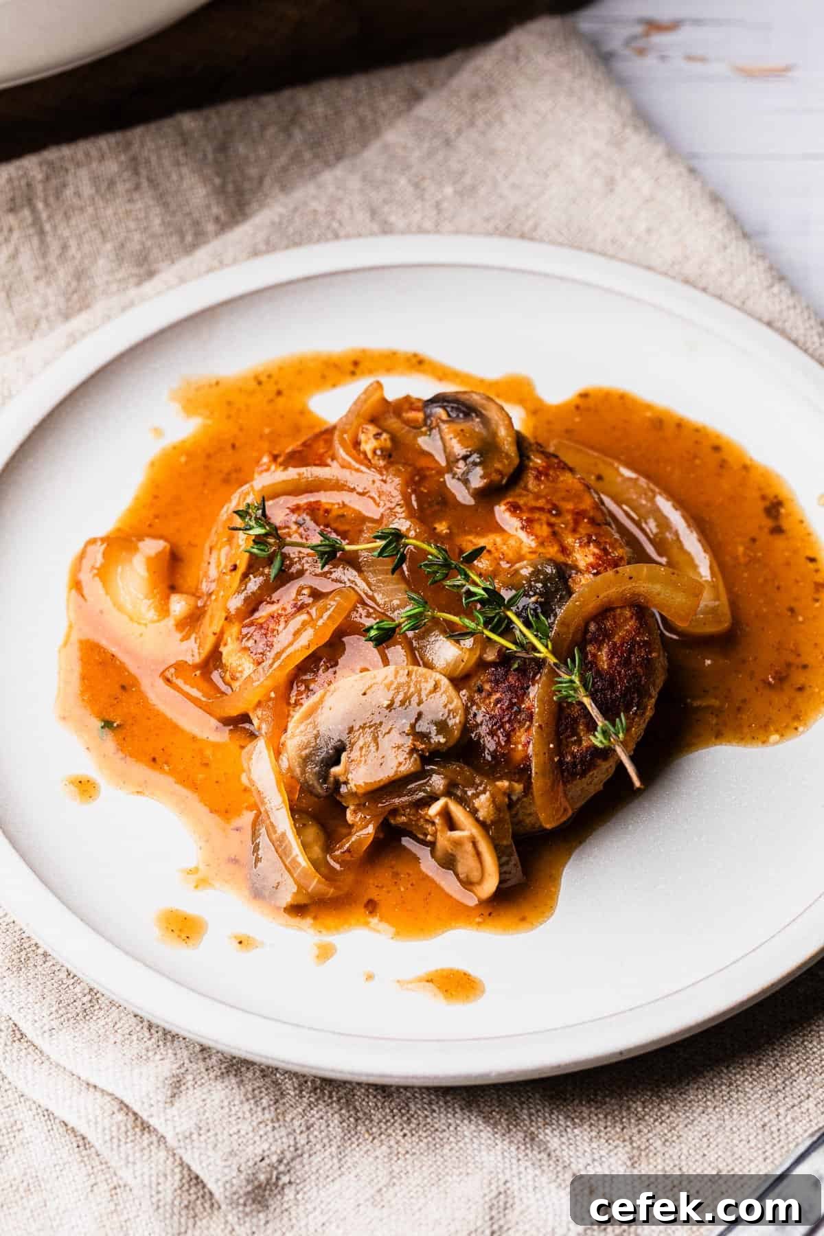 Ground Turkey Salisbury Steak with Mushroom Gravy 7 The completed turkey salisbury steak recipe on a plate.