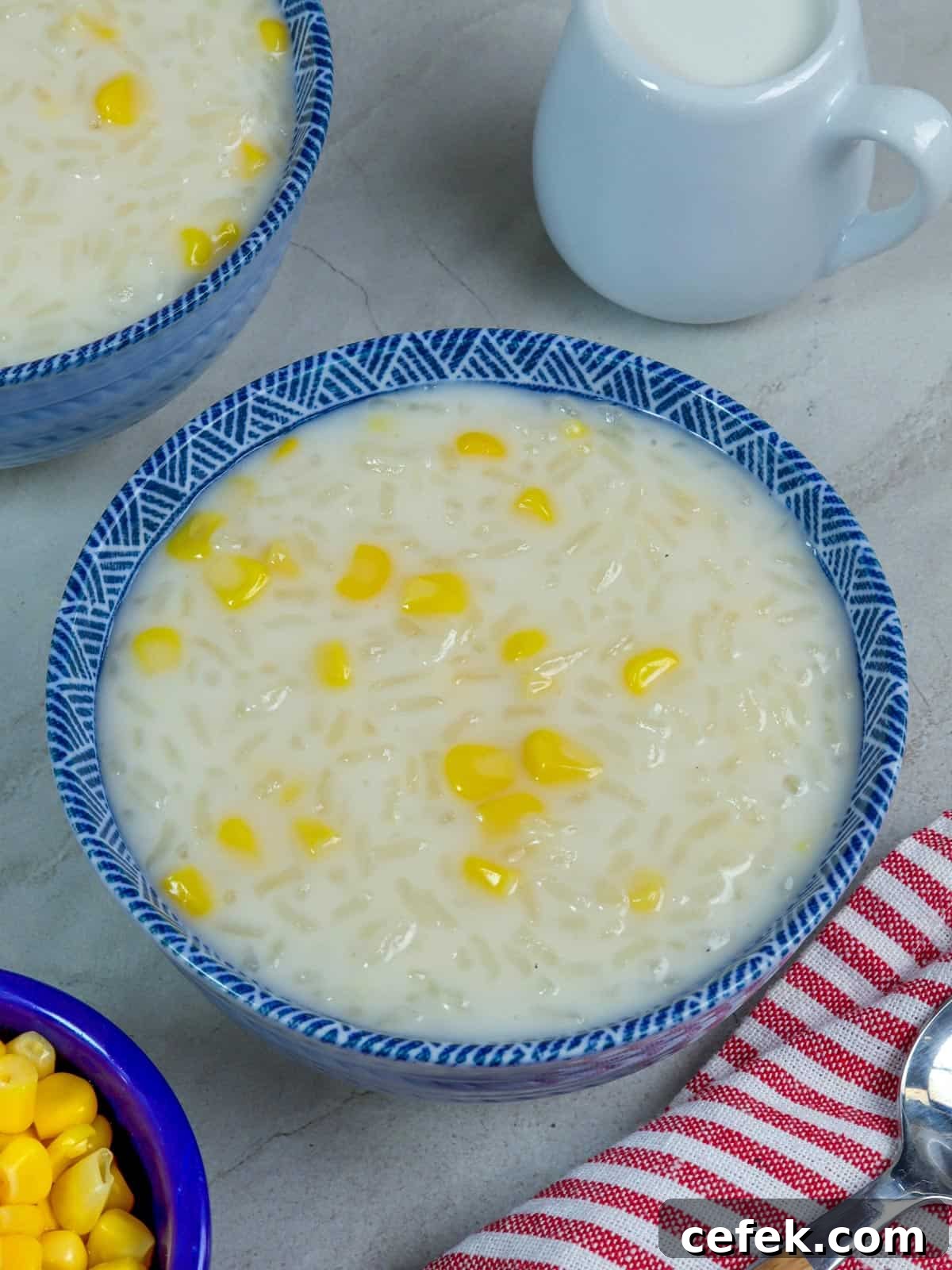 Creamy Filipino Corn and Coconut Milk Porridge 2 Ginataang Mais in a blue bowl.