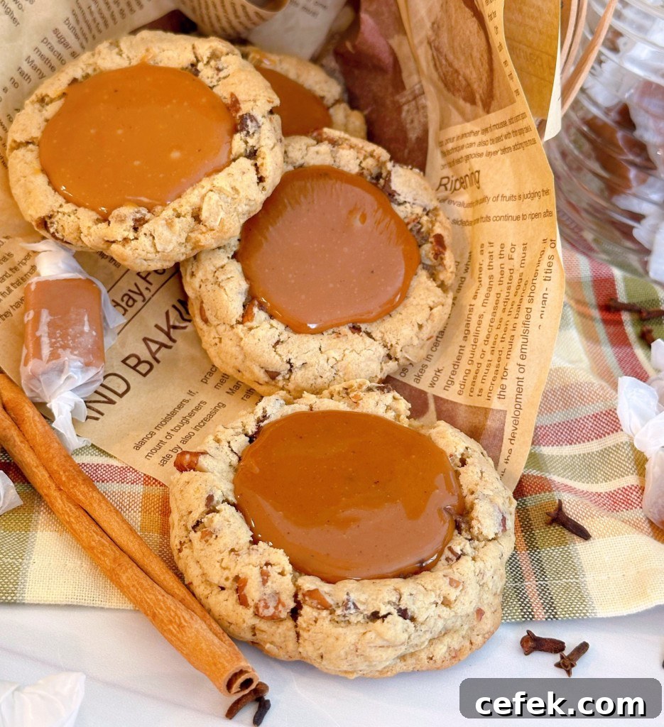 Carmalita Cookies on a paper with cinnamon sticks.