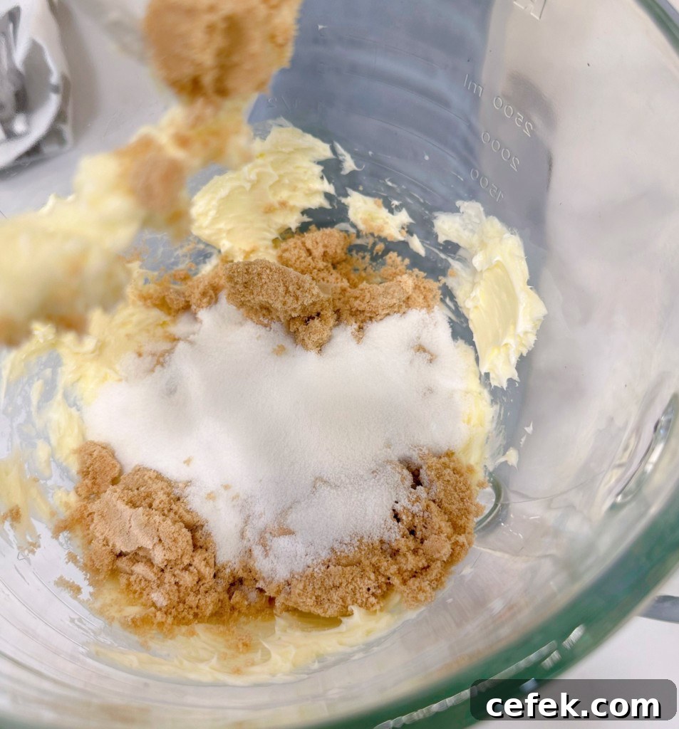 Creaming together brown sugar, white sugar and butter.