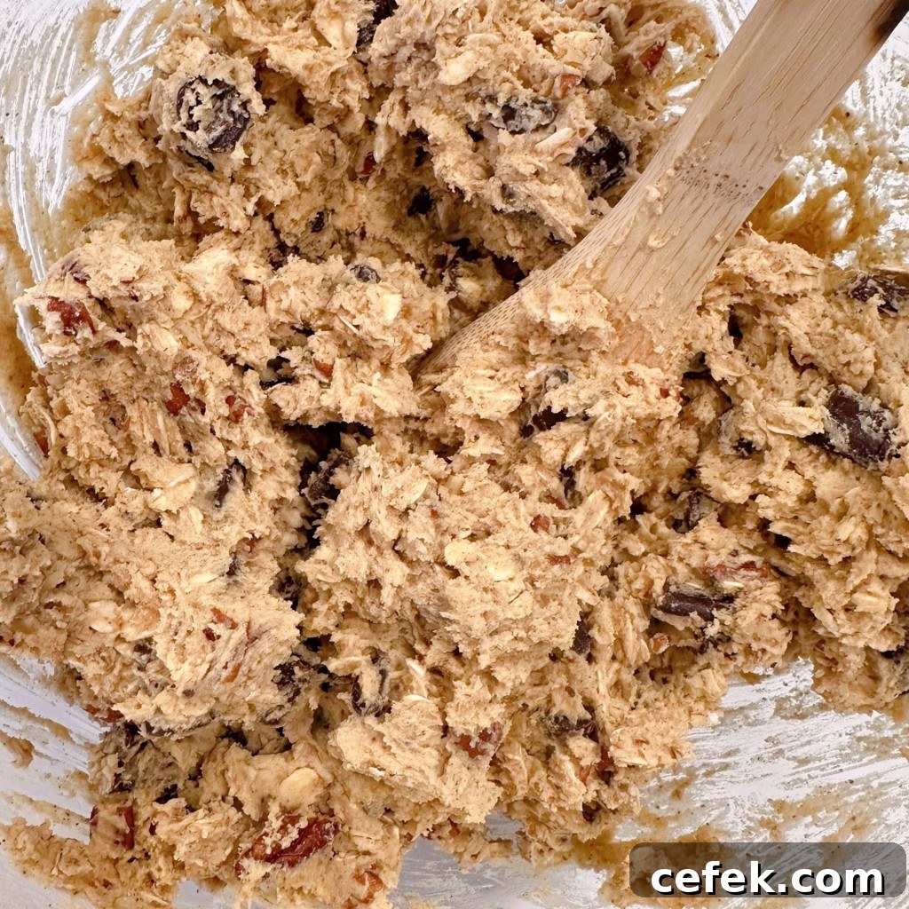 Pumpkin chocolate chunk cookie dough in a mixing bowl.