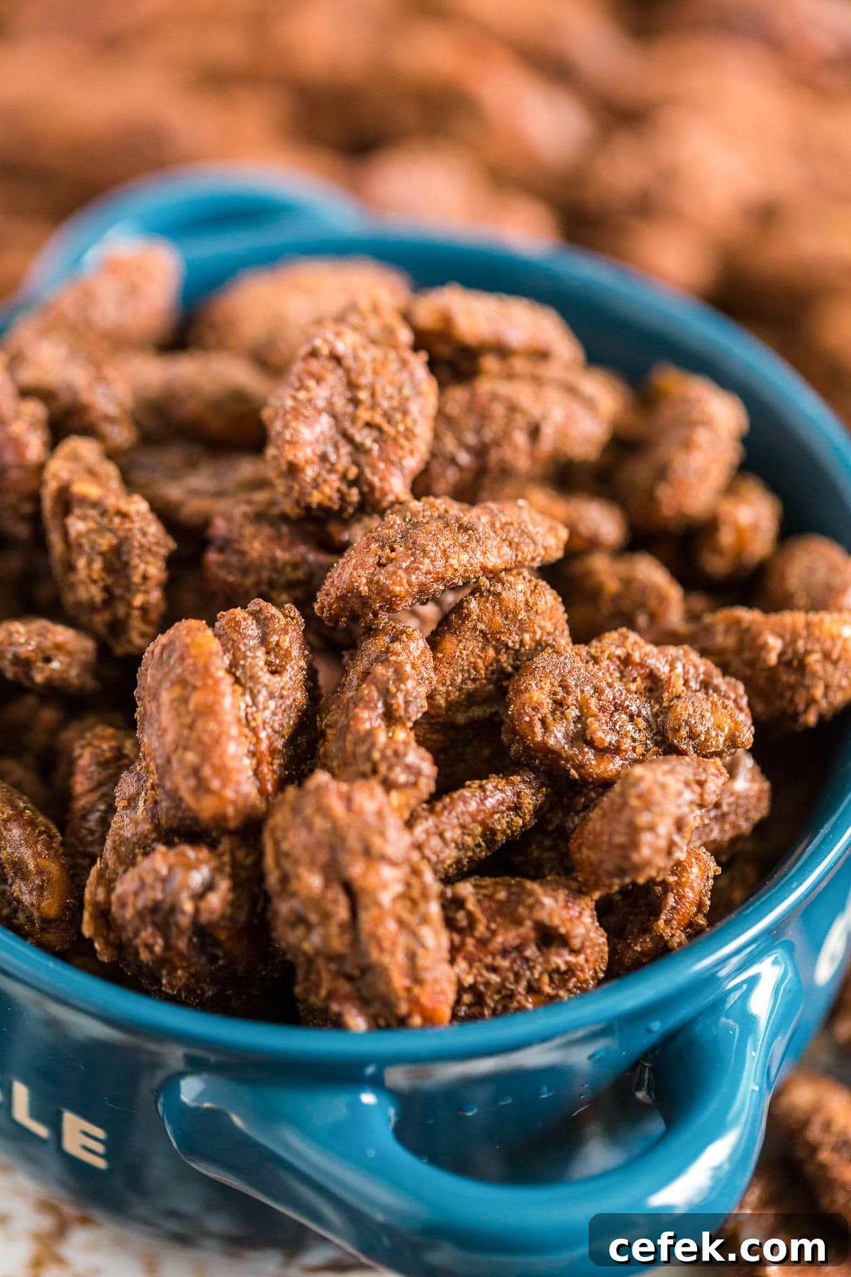 Gingerbread-Spiced Candied Pecans 2 Gingerbread Candied Pecans in a blue serving bowl.