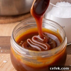 Caramel sauce being poured into a jar