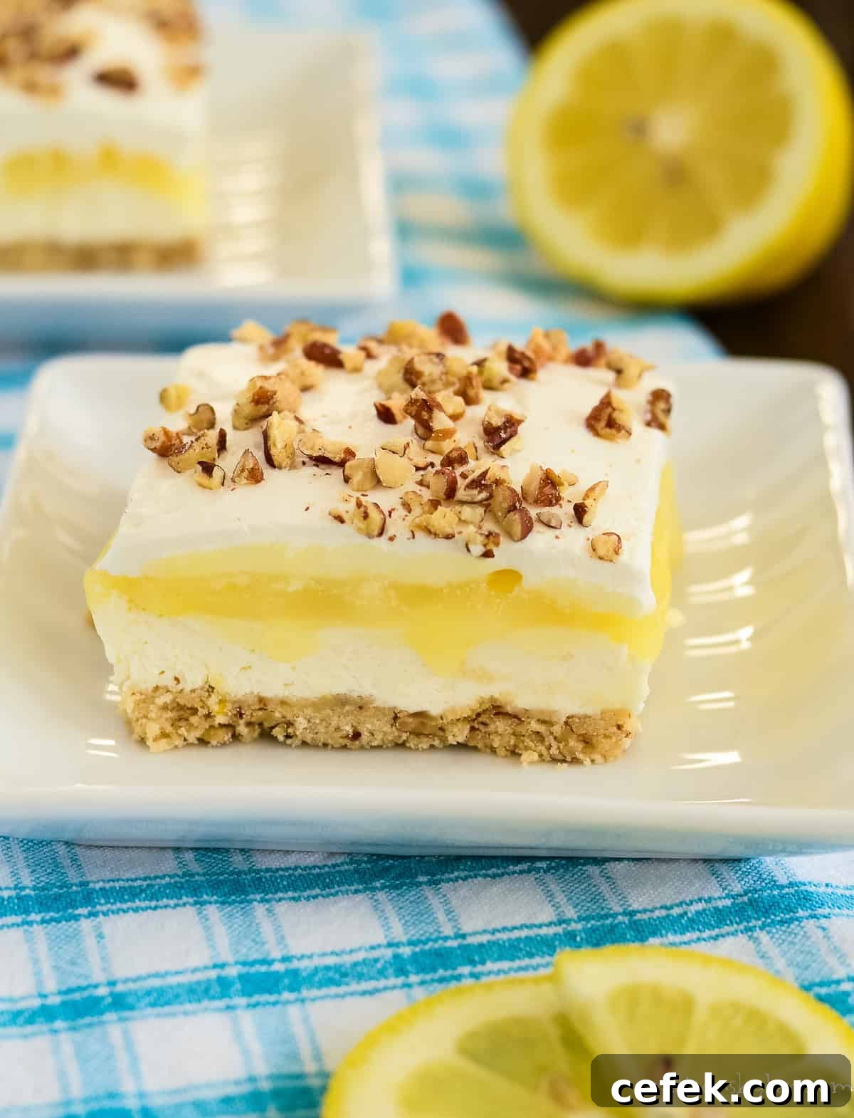 Lemon Lush Dessert Recipe: Creamy Layered Lemon Bars 2 made from scratch lemon lush topped with pecans