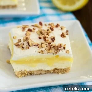 Lemon Lush Dessert Recipe: Creamy Layered Lemon Bars 10 slice of lemon lush dessert on a plate
