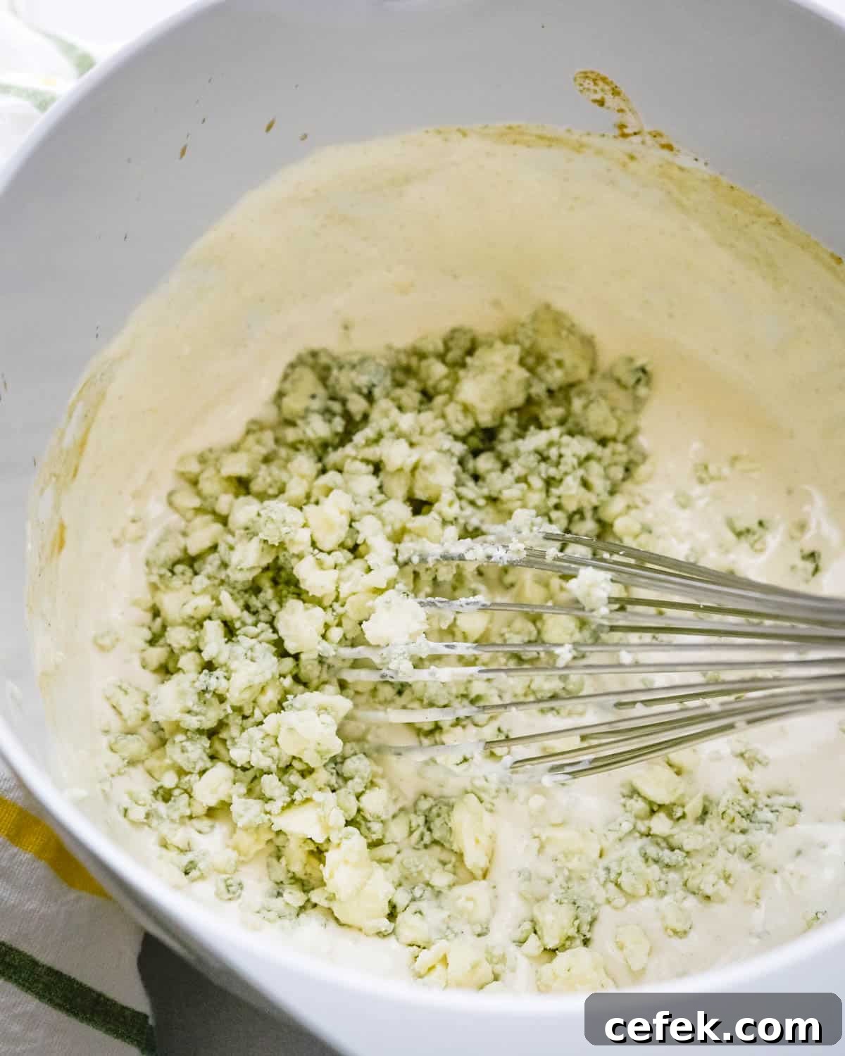 Homemade Chunky Blue Cheese Dressing for Wings and Salads 5 We are adding blue cheese crumbles to the bowl.