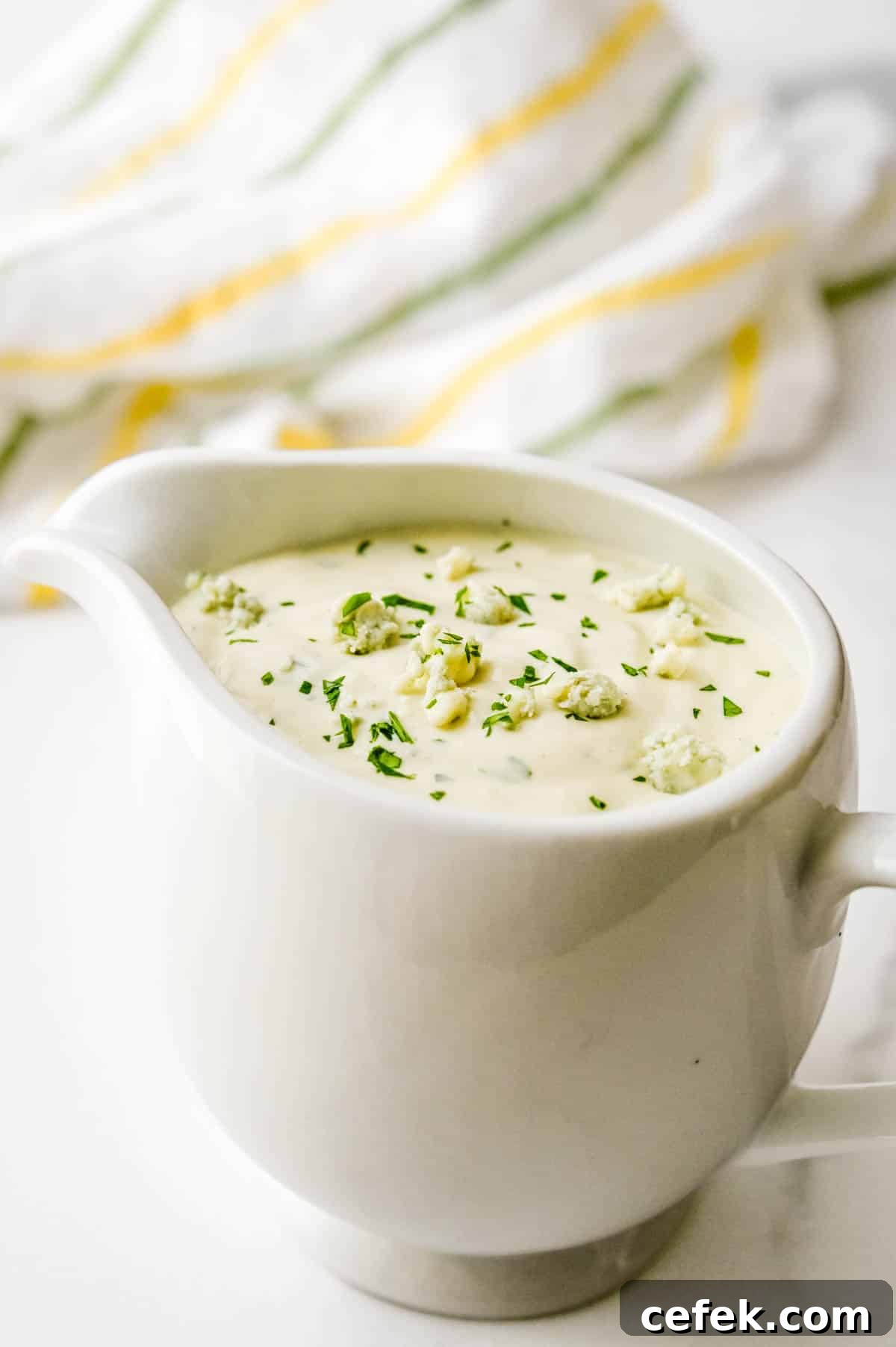 Homemade Chunky Blue Cheese Dressing for Wings and Salads 6 Serving the dressing in a mini pitcher.