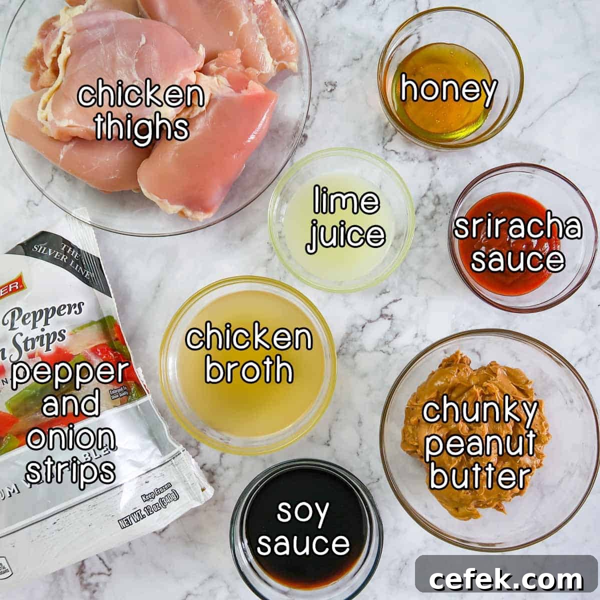 Spicy Slow Cooker Thai Peanut Chicken Recipe 3 Overhead shot of ingredients- chicken thighs, pepper and onion strips, chicken broth, lime juice, honey, sriracha sauce, chunky peanut butter, soy sauce.