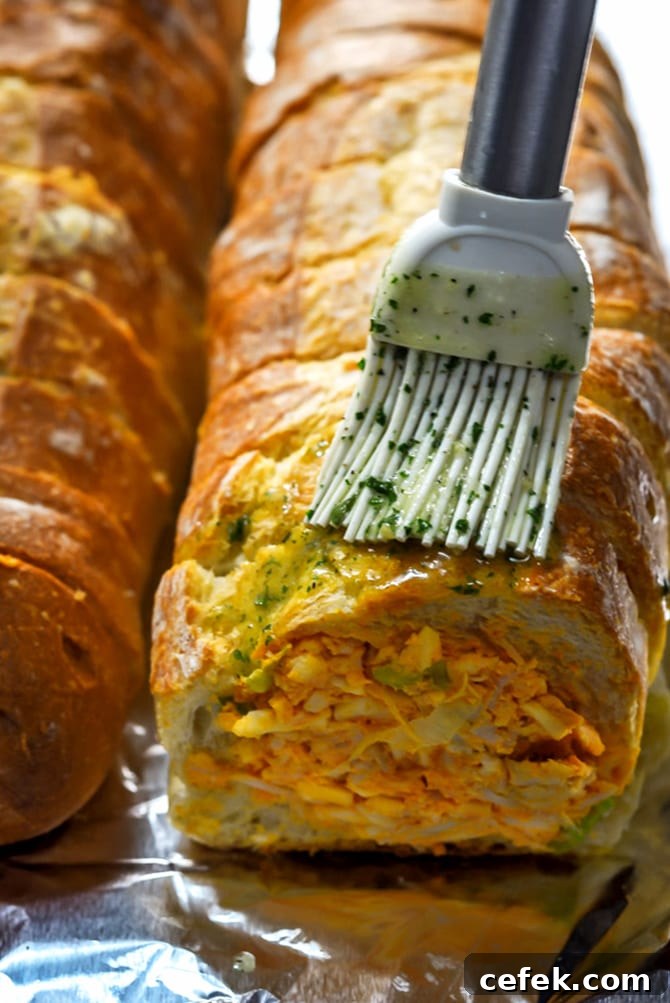 Cheesy Buffalo Chicken Dip Stuffed Bread 5 Buffalo Chicken Dip Stuffed Bread with ranch butter brushed on top
