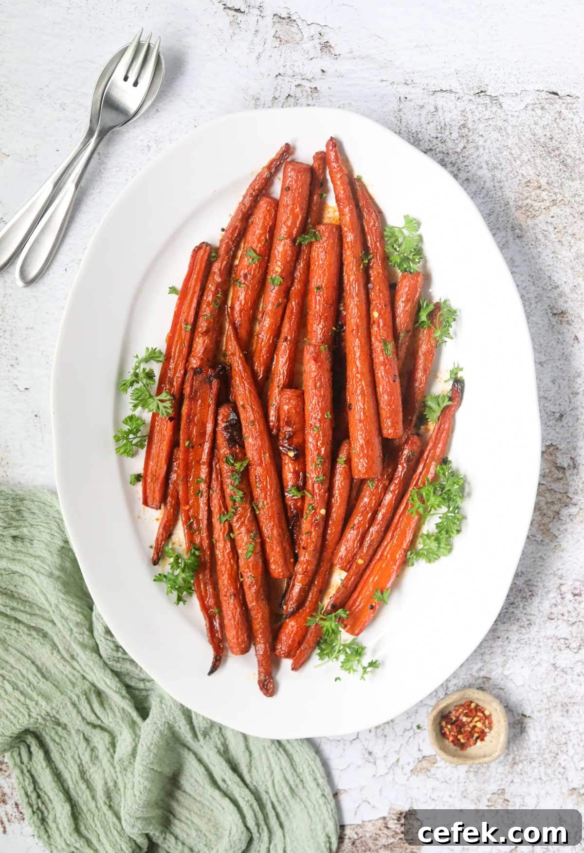 Maple-Glazed Roasted Carrots Recipe 3 Maple roasted carrots on a white platter.