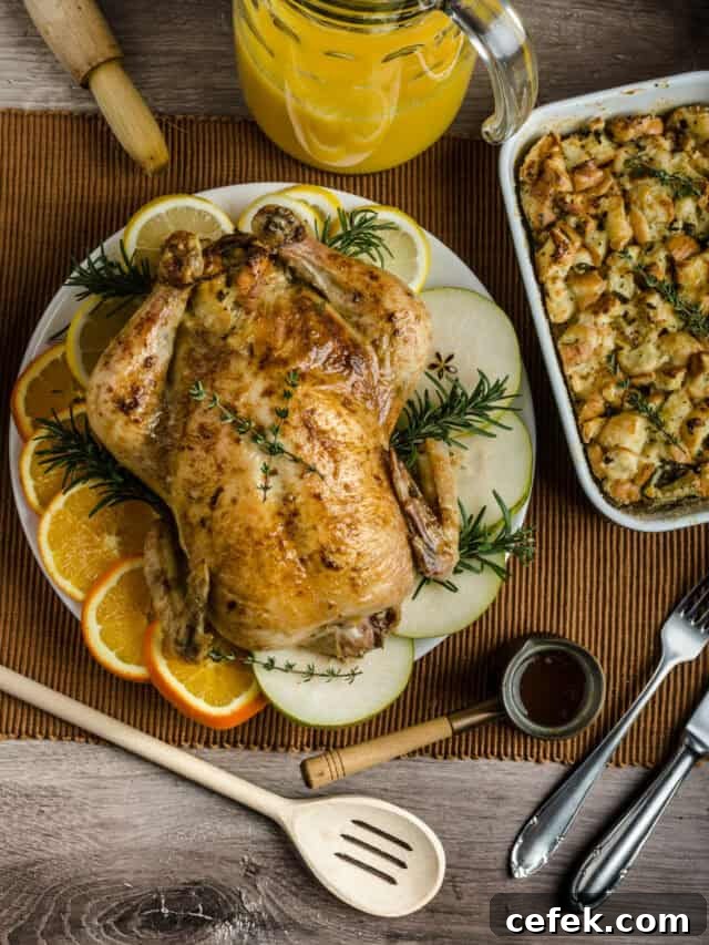 How to Roast a Juicy Turkey: Complete Guide 3 Turkey on a platter with fruit and serving utensils.