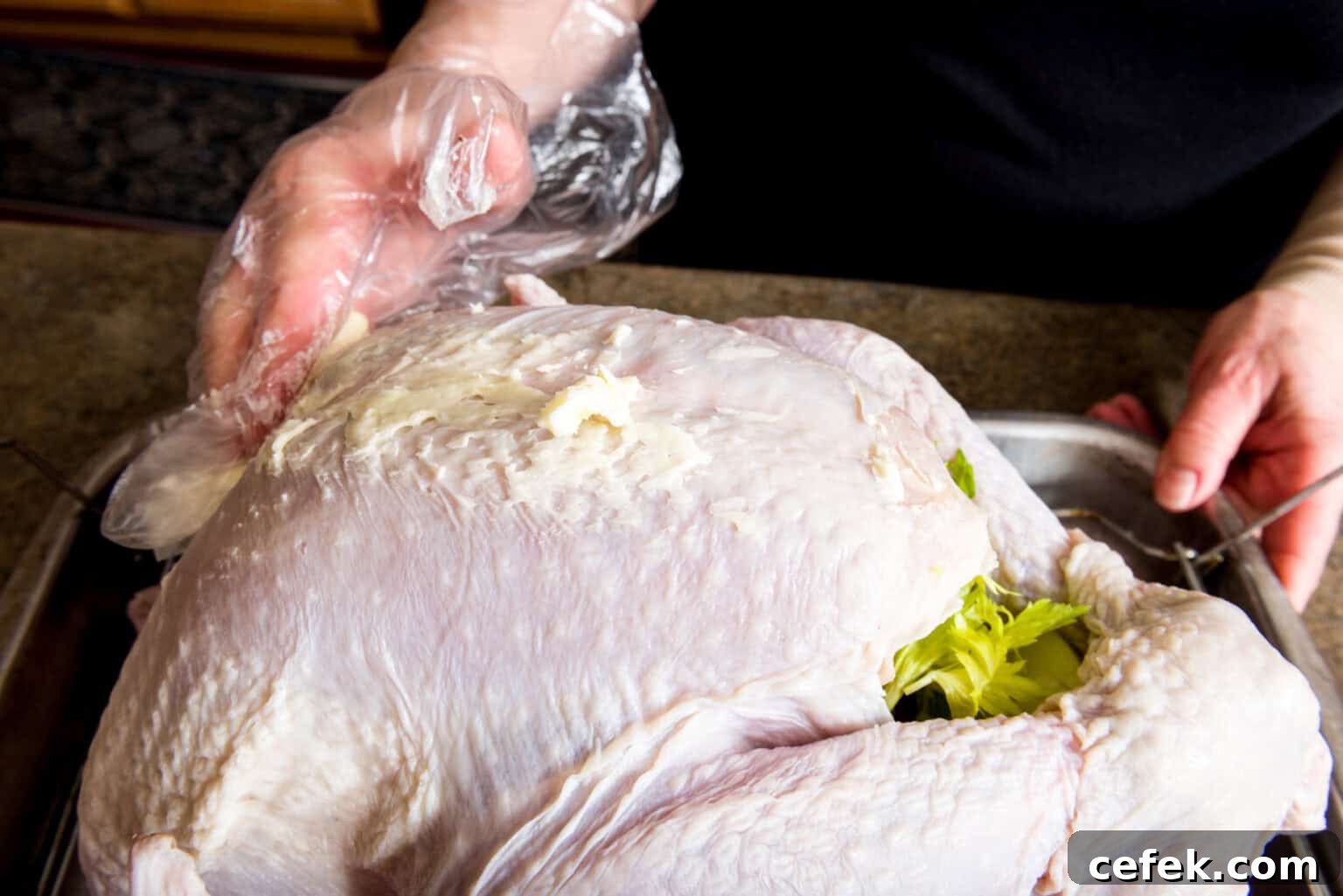 How to Roast a Juicy Turkey: Complete Guide 5 Applying the butter to the convection oven turkey
