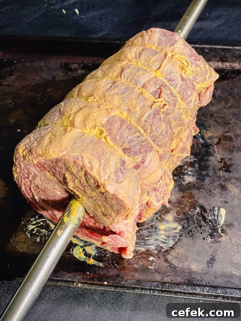 Rotisserie Prime Rib: How to Cook a Tender, Juicy Roast 13 prime rib roasted coated with dijon mustard