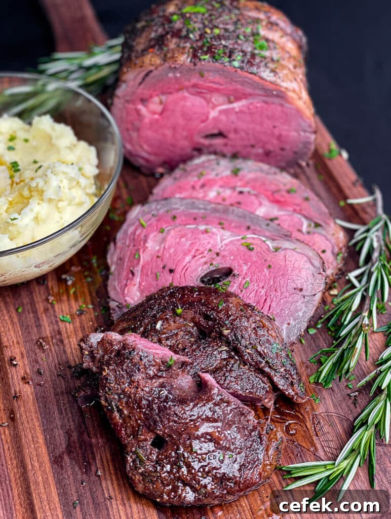 Rotisserie Prime Rib: How to Cook a Tender, Juicy Roast 17 sliced prime rib roast on a cutting board