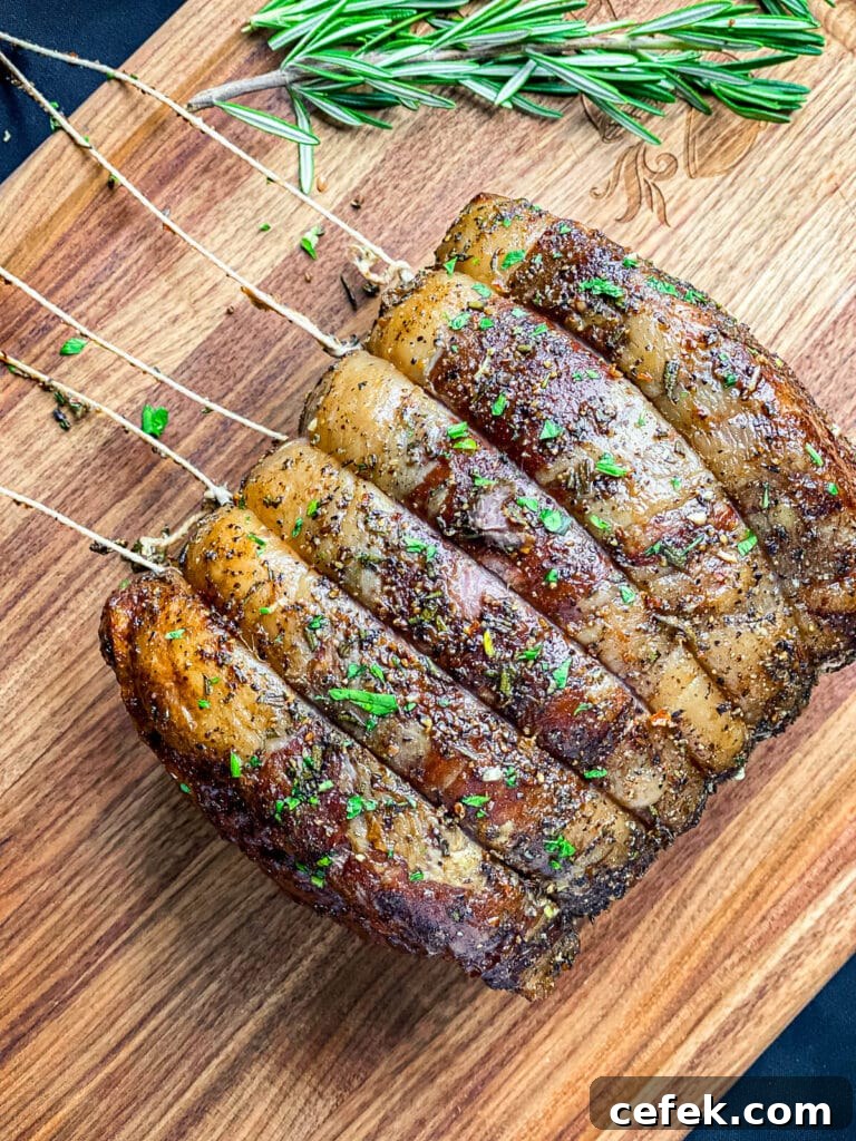 Rotisserie Prime Rib: How to Cook a Tender, Juicy Roast 5 beef with butchers twine being cut away from the meat