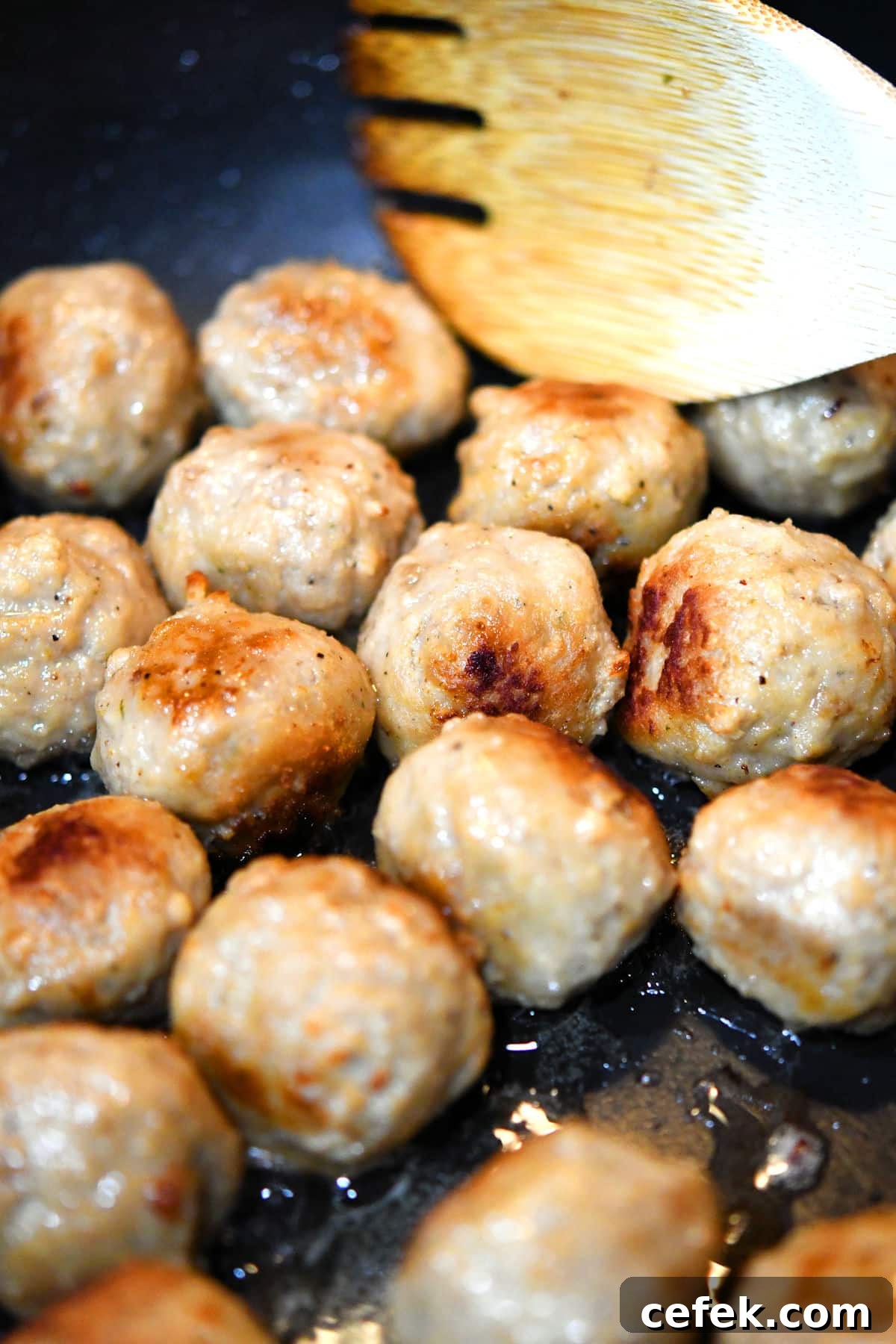 Creamy Meatball Stroganoff with Frozen Meatballs 6 closeup of meatballs in a skillet with a little bit of sear