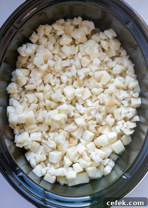 Creamy Cheddar Slow Cooker Potatoes 3 Slow cooker cheesy potatoes in a crock pot