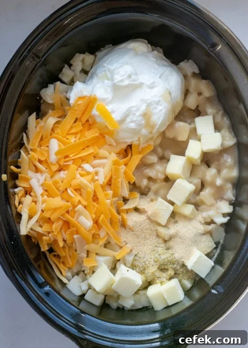 Creamy Cheddar Slow Cooker Potatoes 4 Creamy cheesy potato casserole in slow cooker