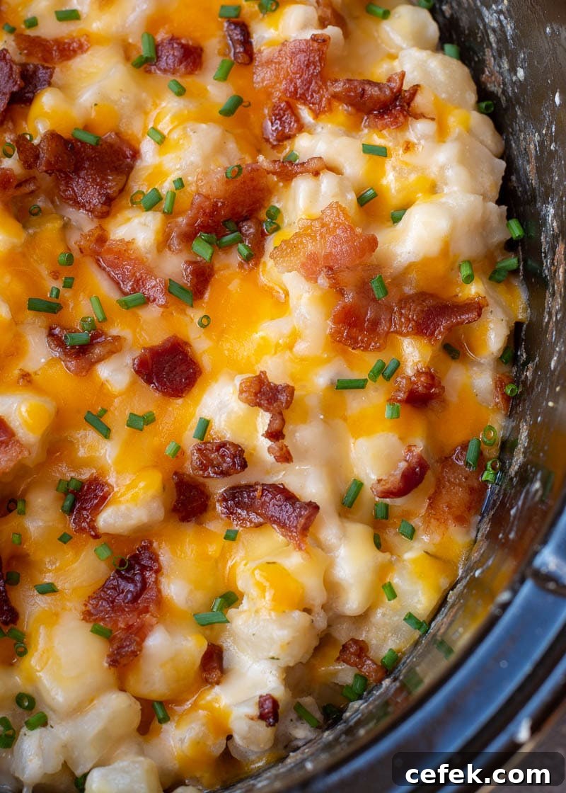 Creamy Cheddar Slow Cooker Potatoes 7 Close-up of cheesy potatoes with bacon and green onions