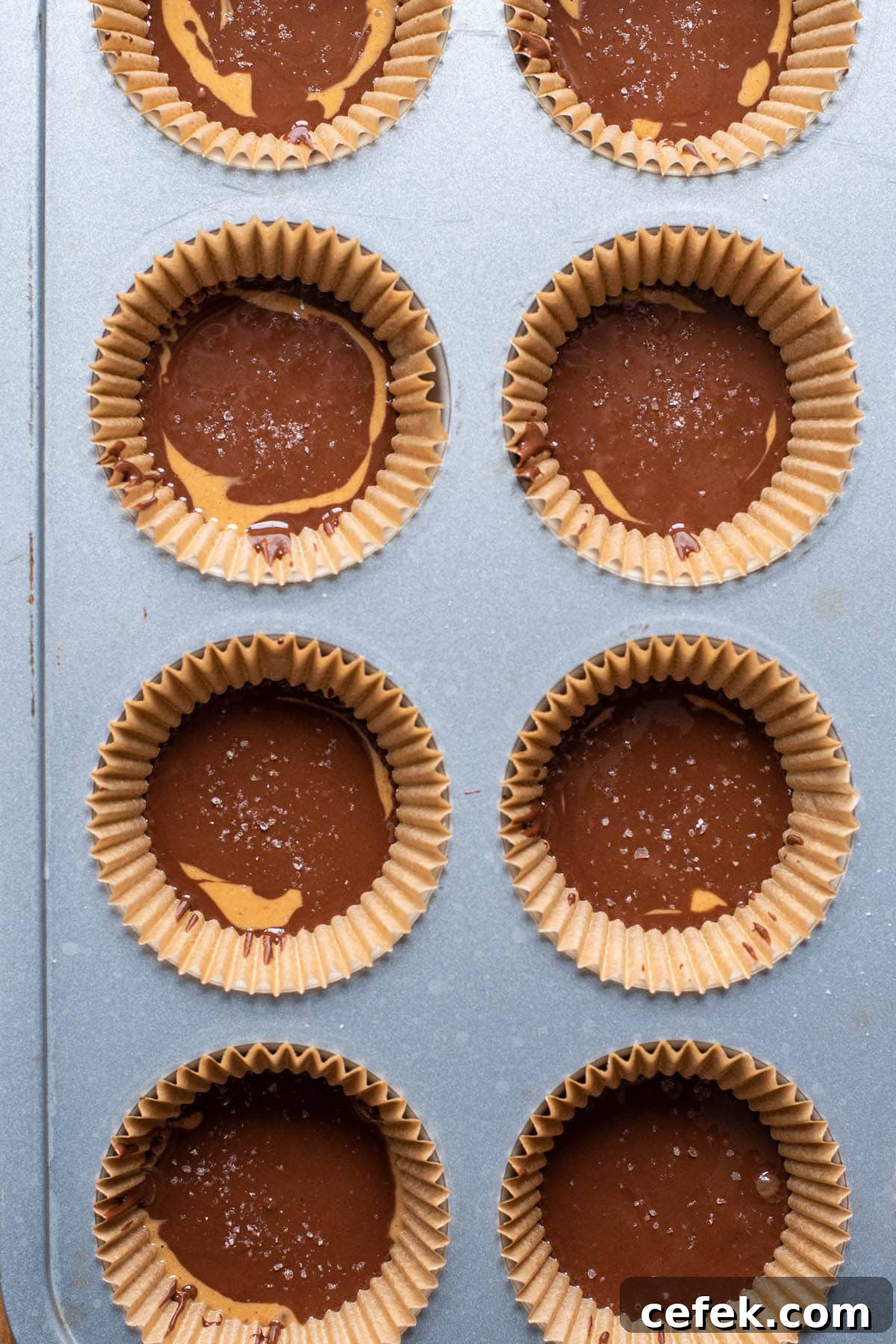 No-Bake 2-Ingredient Peanut Butter Cups 7 Homemade peanut butter cups sprinkled with sea salt before freezing.