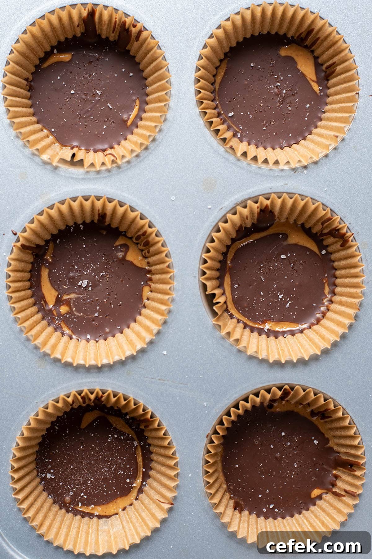 No-Bake 2-Ingredient Peanut Butter Cups 8 Finished homemade peanut butter cups in muffin tin.