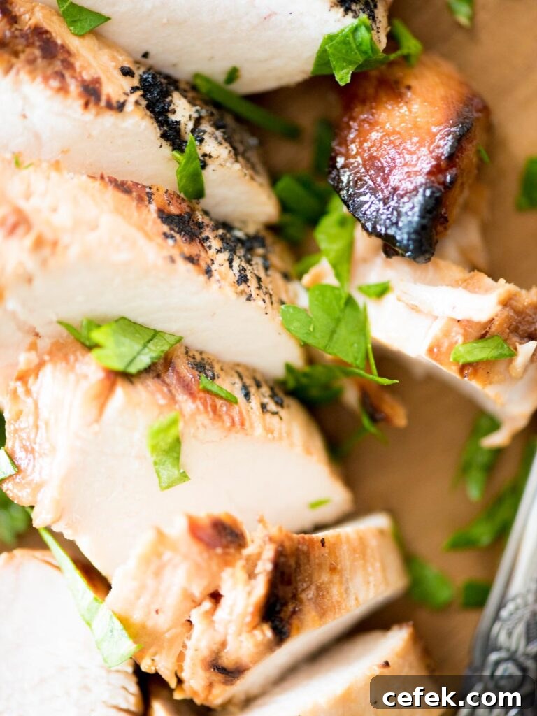 Juicy Marinated Grilled Chicken Recipe 6 grilled marinated chicken sliced on a cutting board