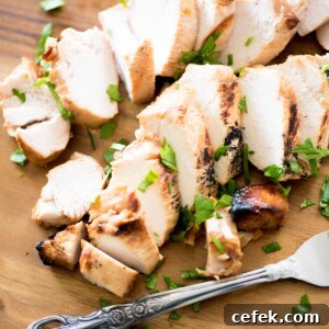 Juicy Marinated Grilled Chicken Recipe 7 sliced marinated grilled chicken on a cutting board