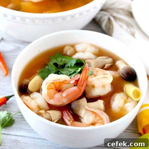 Authentic Thai Tom Yum Soup with Shrimp 8 Tom Yum Soup with Shrimp in a white bowl