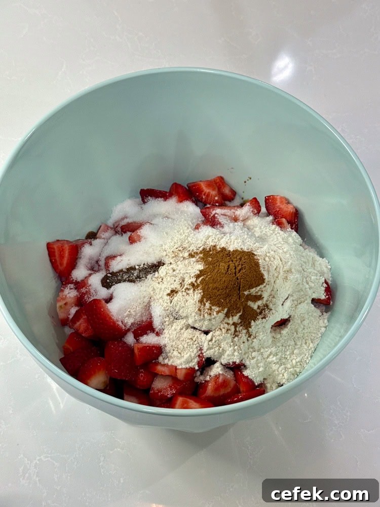 Classic Strawberry Rhubarb Pie Recipe 10 diced rhubarb, sliced strawberries, sugar, flour, cinnamon, and vanilla extract in a bowl