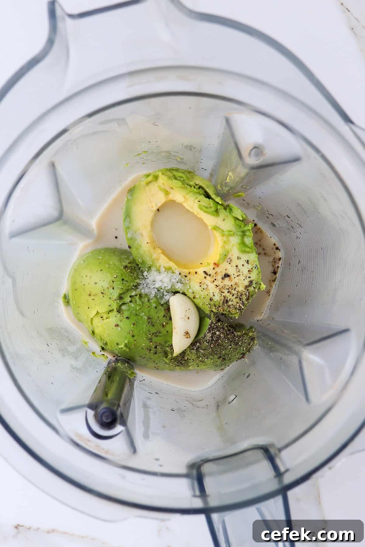 White Bean and Kale Salad with Creamy Avocado Dressing 5 Avocado, garlic clove, milk, salt and pepper in a blender jug.