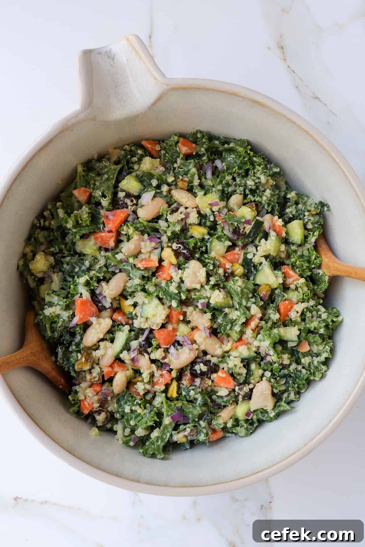 White Bean and Kale Salad with Creamy Avocado Dressing 9 Kale salad in a mixing bowl.