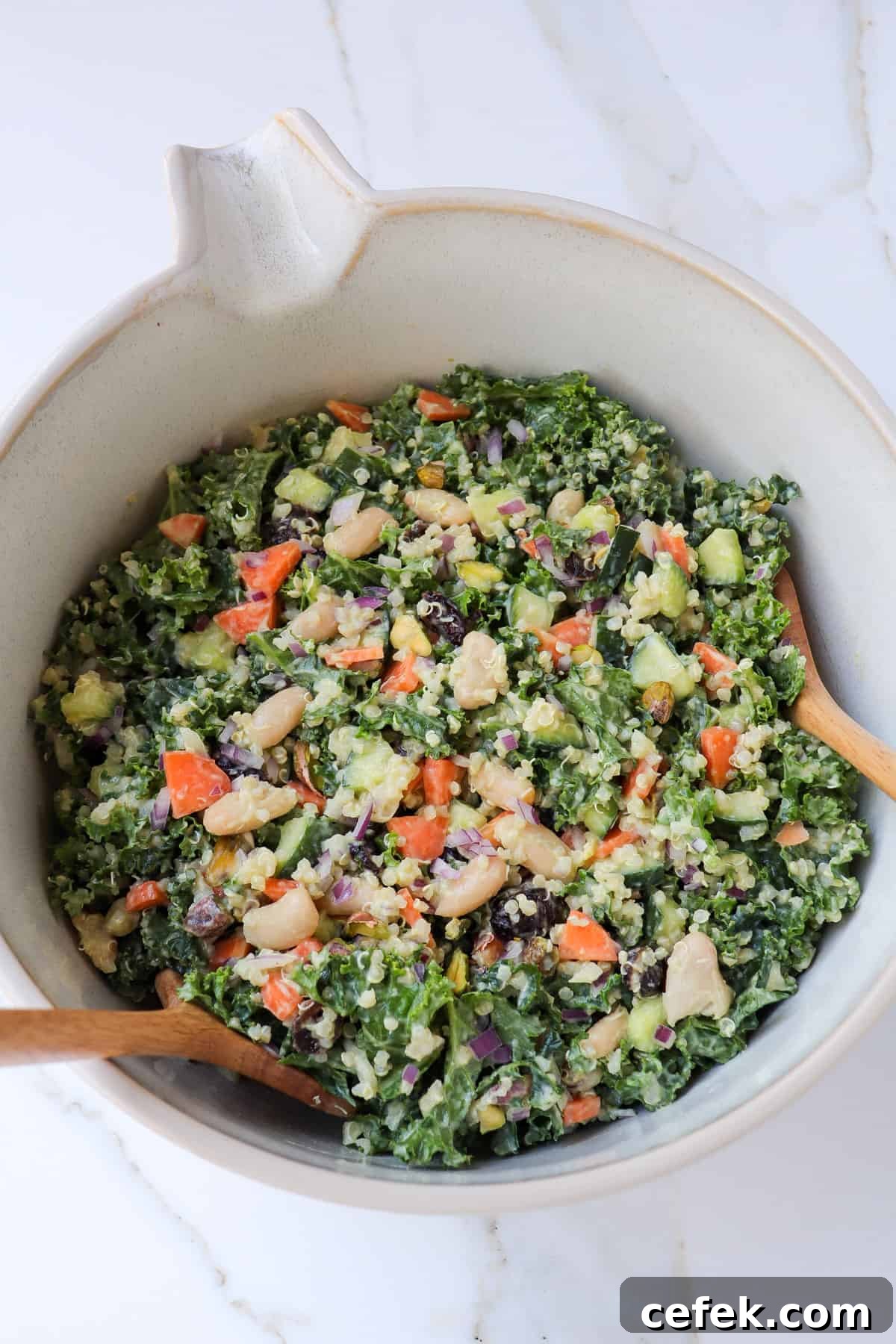White Bean and Kale Salad with Creamy Avocado Dressing 10 Side shot of salad in a bowl.