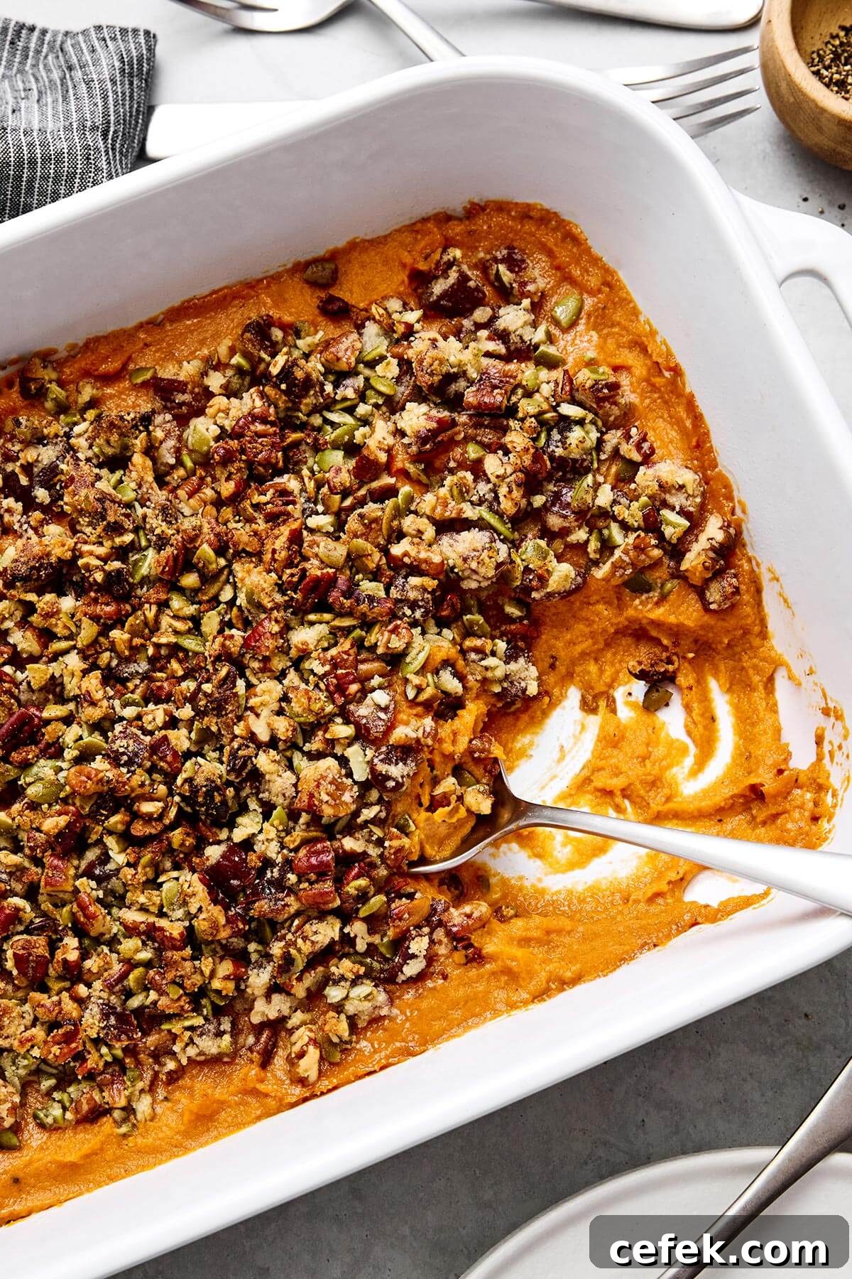 Gluten-Free Thanksgiving Menu: Recipes for a Festive Feast 11 Sweet potato casserole with a spoon.