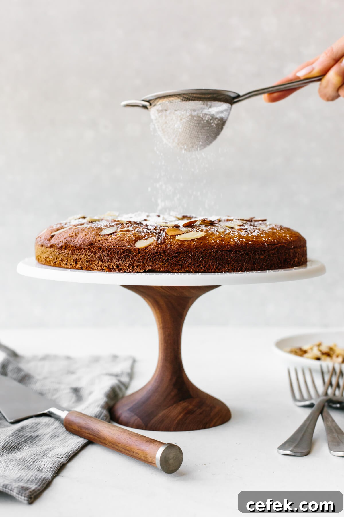 Gluten-Free Thanksgiving Menu: Recipes for a Festive Feast 27 Dusting powdered sugar on a cake