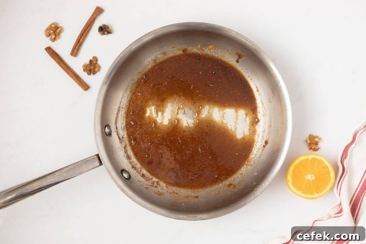 Recipe Candied Walnuts Orange juice, orange zest, brown sugar, white sugar, cinnamon, salt, and cayenne whisked together in stainless steel skillet.